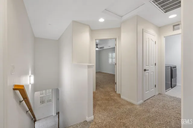 a view of a bathroom with a shower and a sink