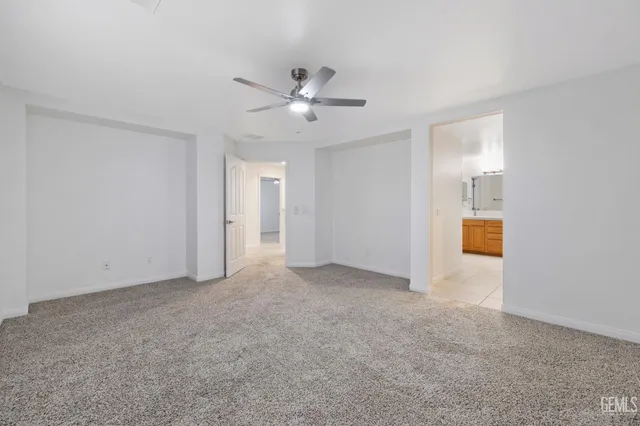 a bathroom with a granite countertop sink toilet a large mirror and shower