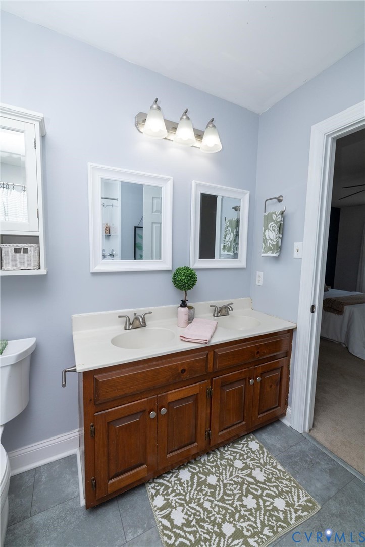 7070 Mill Valley Road Mechanicsville, VA 23111 - Photo 48 of 64 Dual vanity with wood-finish cabinetry, integrated