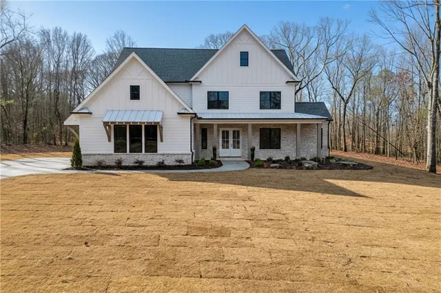 a front view of a house with yard