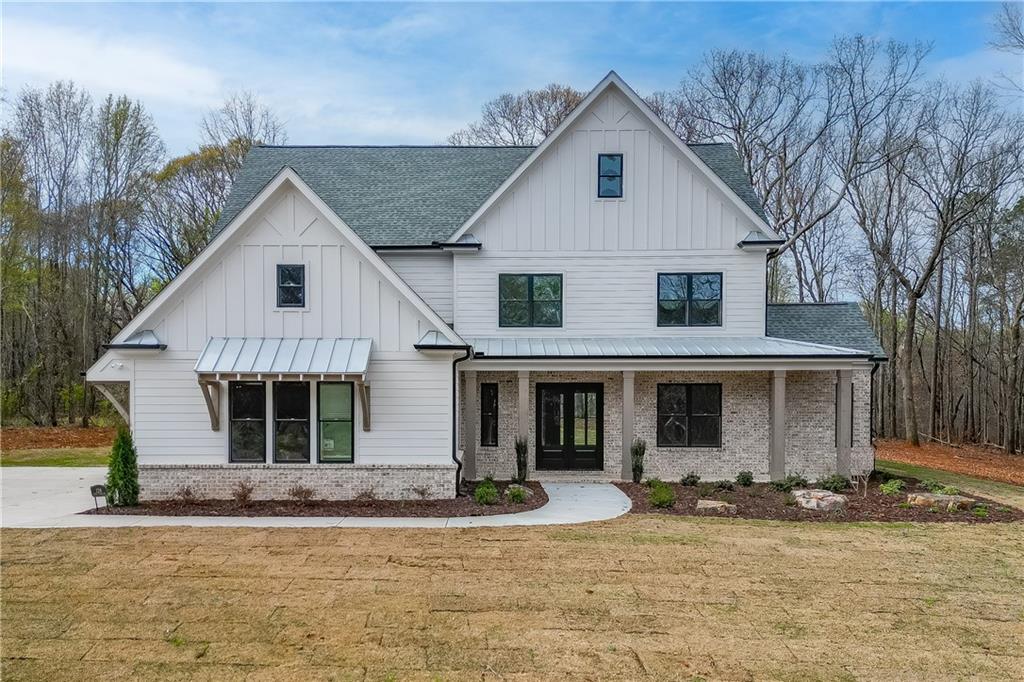 128 Ivey Trace Pendergrass, GA 30567 - Photo 1 of 57 a front view of a house with yard