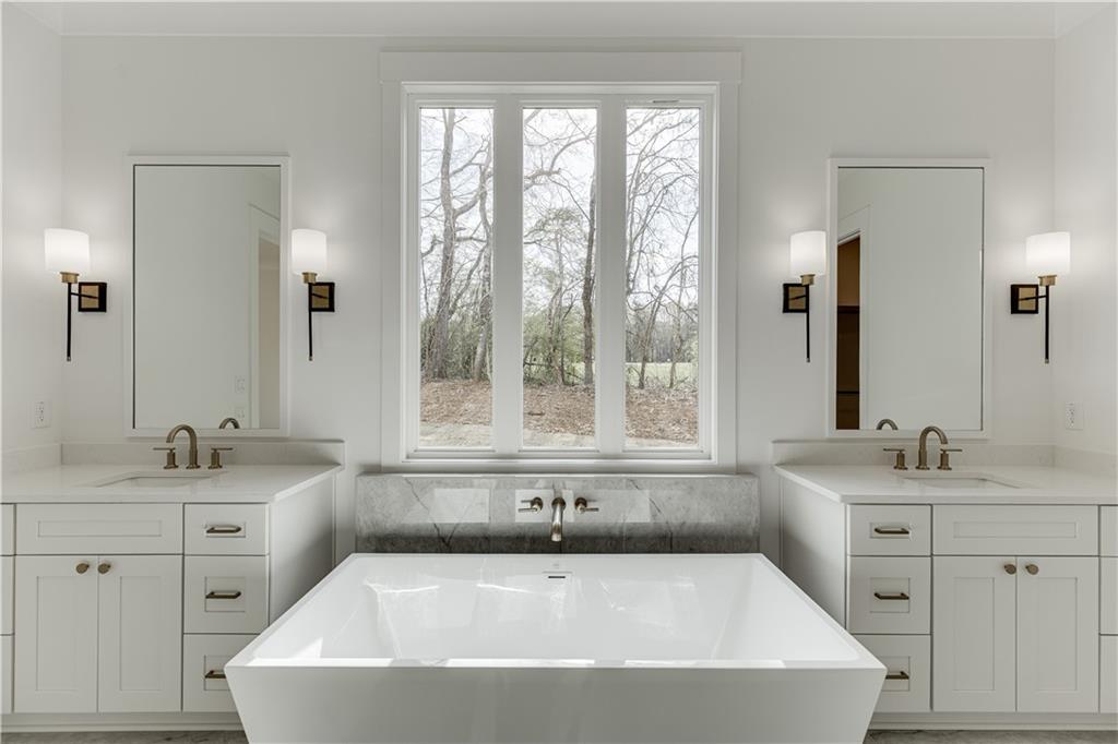 128 Ivey Trace Pendergrass, GA 30567 - Photo 29 of 57 a white bath tub sitting next to a white sink