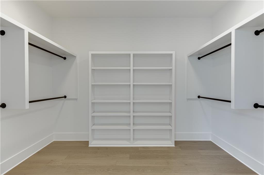 128 Ivey Trace Pendergrass, GA 30567 - Photo 31 of 57 a view of walk in closet with empty racks