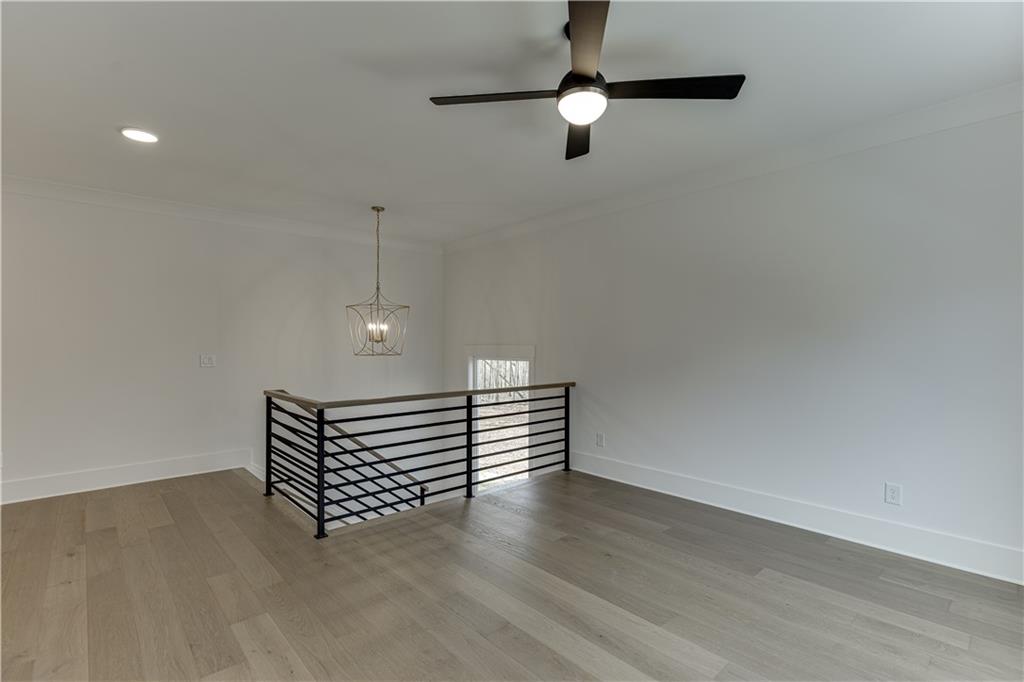 128 Ivey Trace Pendergrass, GA 30567 - Photo 37 of 57 a view of room with stairs and wooden floor