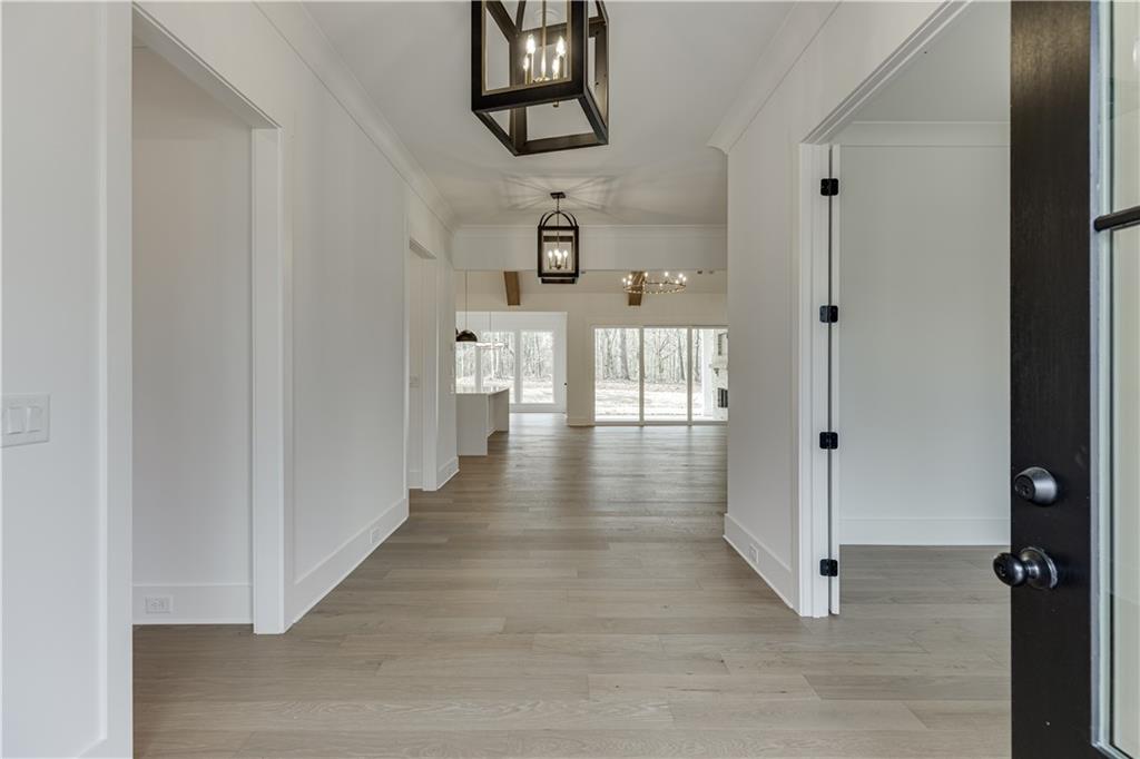 128 Ivey Trace Pendergrass, GA 30567 - Photo 4 of 57 a view of a hallway with wooden floor