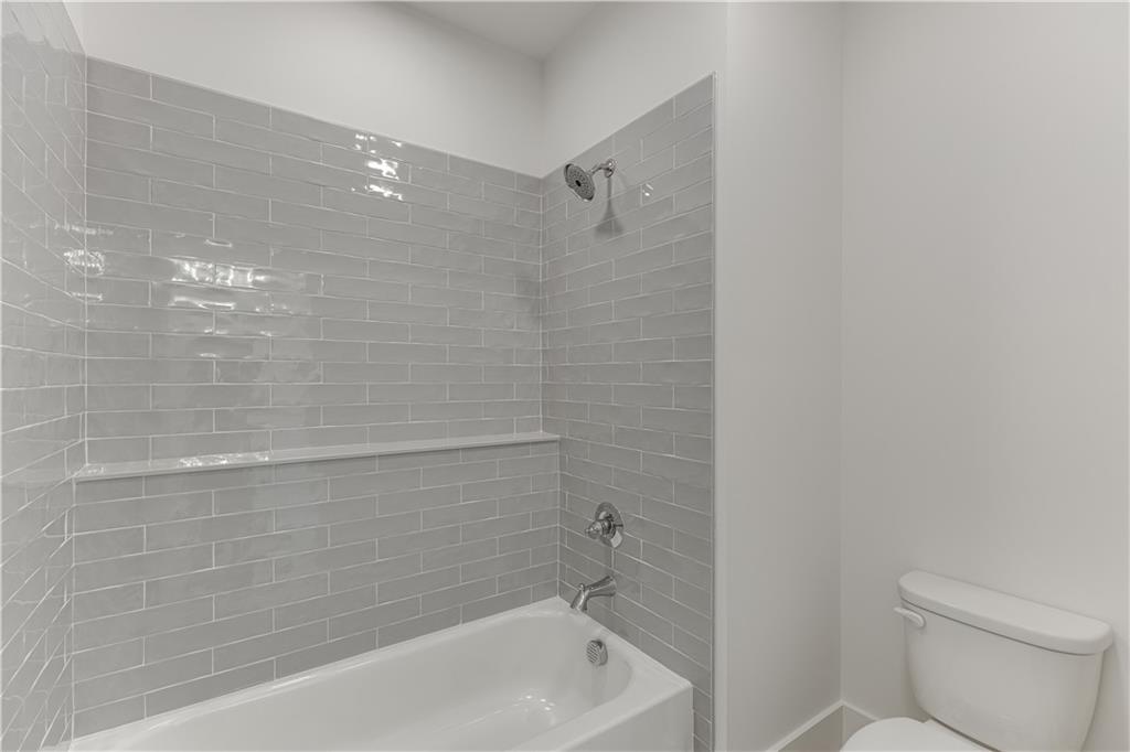 128 Ivey Trace Pendergrass, GA 30567 - Photo 42 of 57 a bathroom with a shower and a toilet