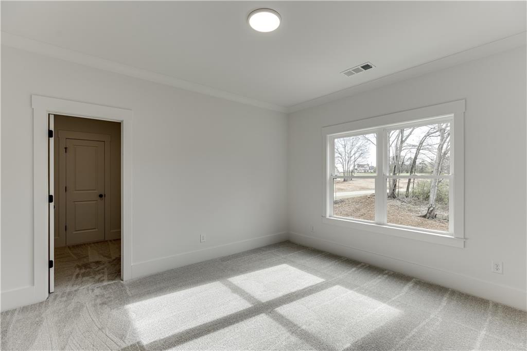 128 Ivey Trace Pendergrass, GA 30567 - Photo 43 of 57 a view of an empty room with a window