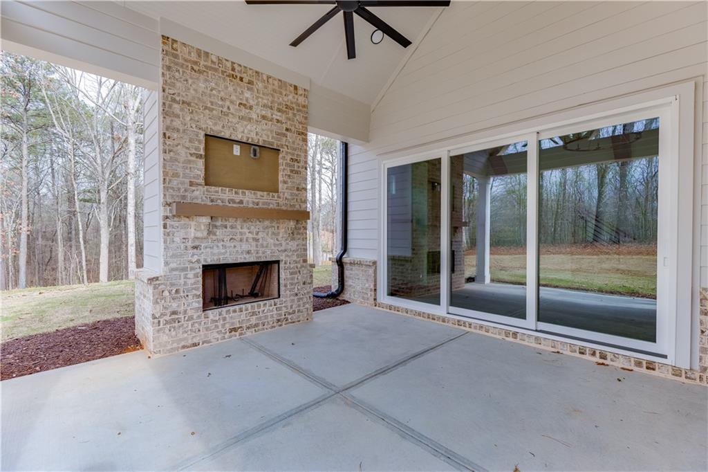 128 Ivey Trace Pendergrass, GA 30567 - Photo 49 of 57 a view of an empty room with glass door and balcony