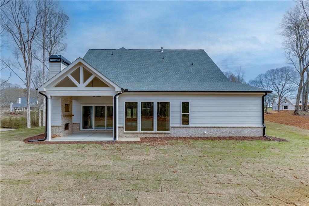 128 Ivey Trace Pendergrass, GA 30567 - Photo 51 of 57 a front view of a house with garden