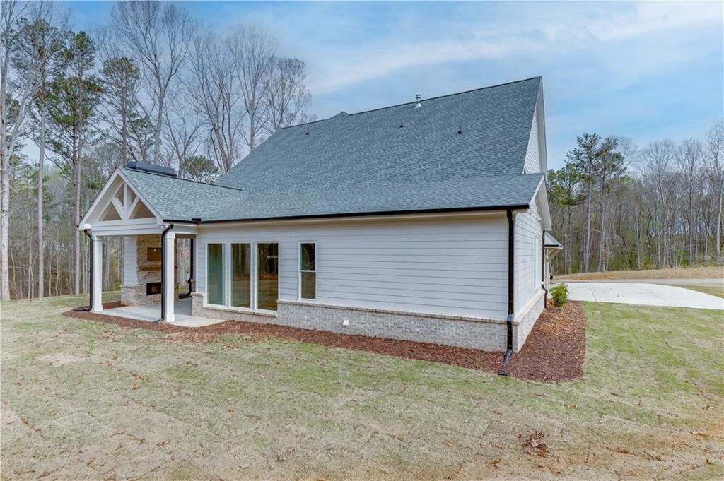128 Ivey Trace Pendergrass, GA 30567 - Photo 52 of 57 a front view of house with an outdoor space