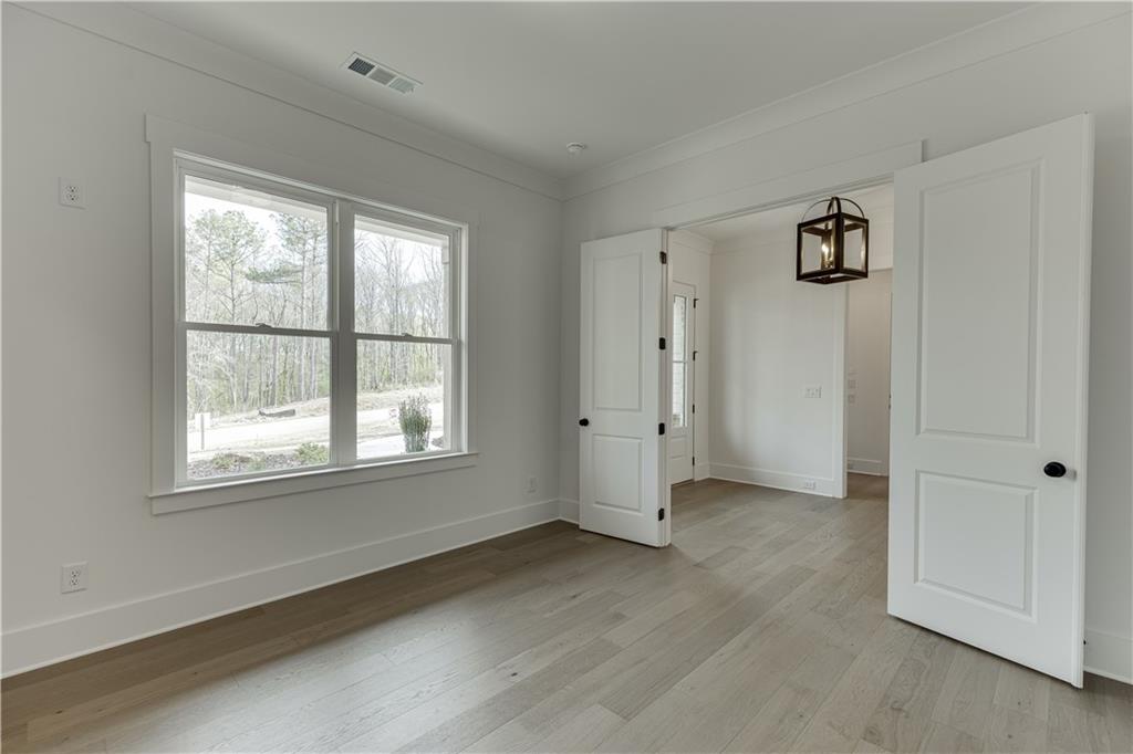 128 Ivey Trace Pendergrass, GA 30567 - Photo 8 of 57 a view of an empty room with a window