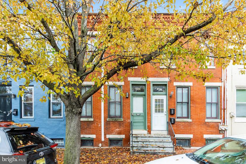 front view of a building with a trees