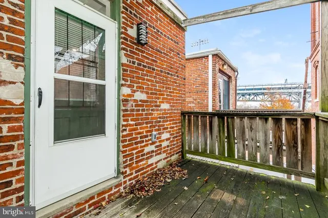 a view of a balcony with wooden floor