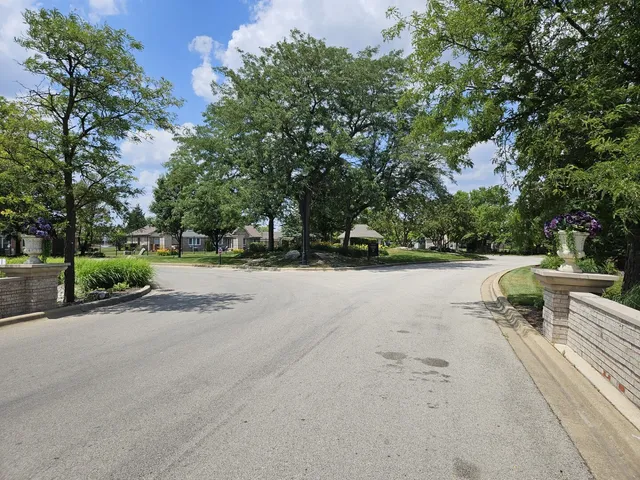 a view of backyard with outdoor seating and trees