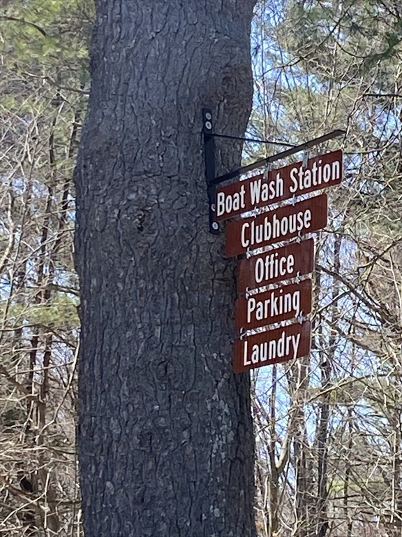 Lot 43 South Village Road Tolland, MA 01034 - Photo 7 of 7 a sign that is sitting on a brick wall