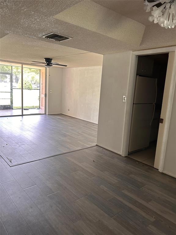 3670 Inverrary Drive Lauderhill, FL 33319 - Photo 5 of 5 an empty room with wooden floor and windows