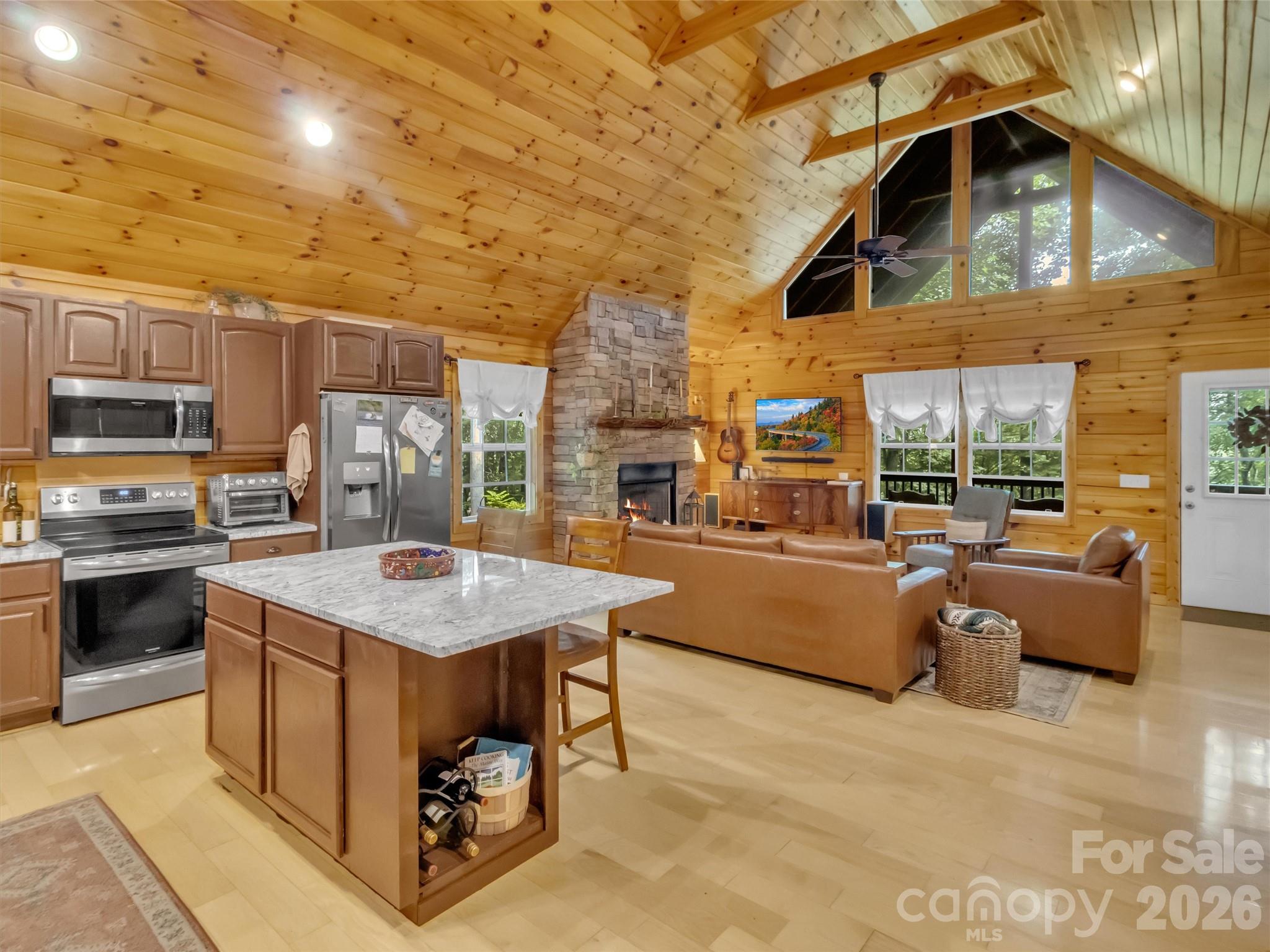 49 Brandywine Road Waynesville, NC 28786 - Photo 6 of 38 a open kitchen with stainless steel appliances granite countertop a stove and a refrigerator