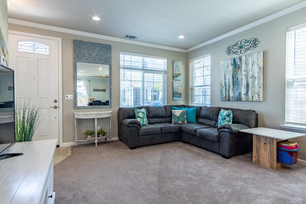 112 Springtime Circle Hollister, CA 95023 - Photo 14 of 63 a living room with furniture and a large window