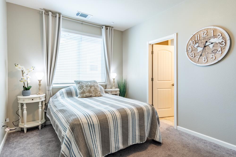 112 Springtime Circle Hollister, CA 95023 - Photo 22 of 63 a bedroom with a bed and a window