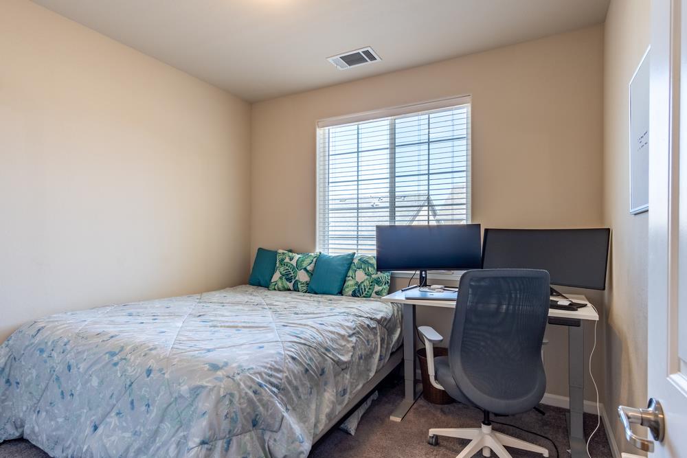 112 Springtime Circle Hollister, CA 95023 - Photo 27 of 63 a bedroom with a bed and chair