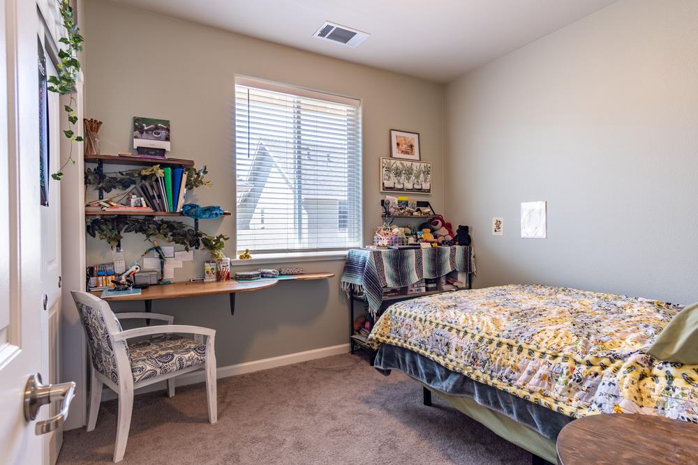 112 Springtime Circle Hollister, CA 95023 - Photo 29 of 63 a bedroom with a bed and a furniture