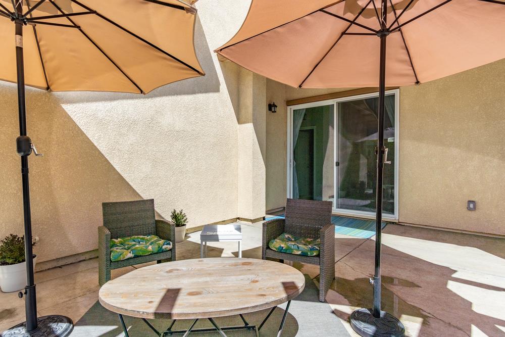 112 Springtime Circle Hollister, CA 95023 - Photo 38 of 63 a backyard of a house with table and chairs