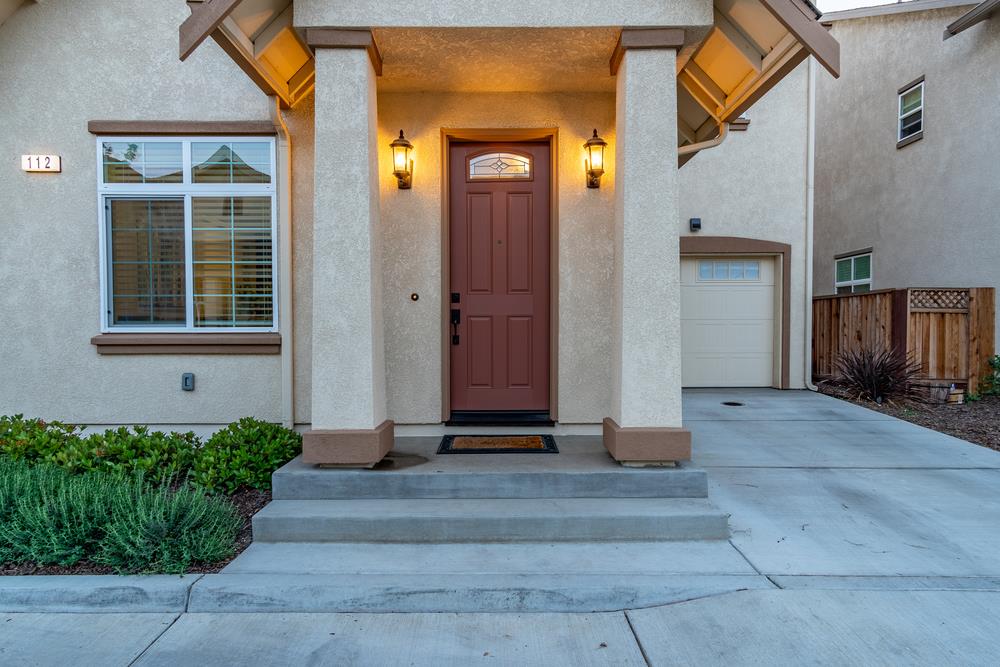 112 Springtime Circle Hollister, CA 95023 - Photo 4 of 63 a front view of a house with a yard