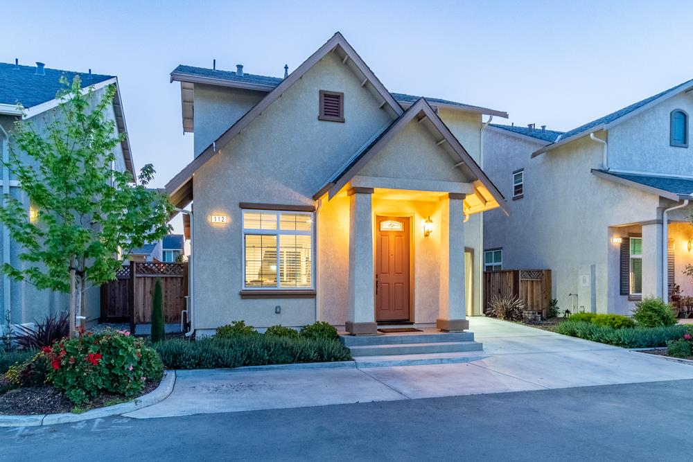 112 Springtime Circle Hollister, CA 95023 - Photo 6 of 63 a view of a house with brick walls and plants