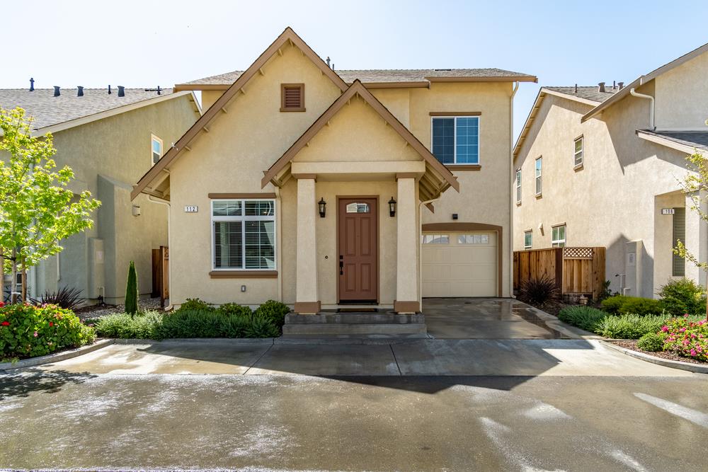 112 Springtime Circle Hollister, CA 95023 - Photo 9 of 63 a front view of a house with a yard