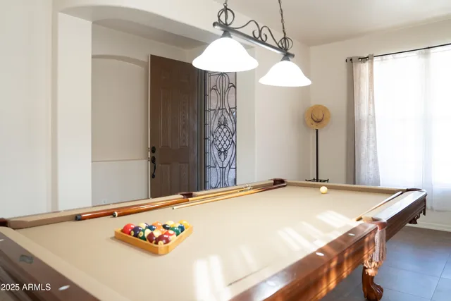 a view of a dining room with furniture and chandelier