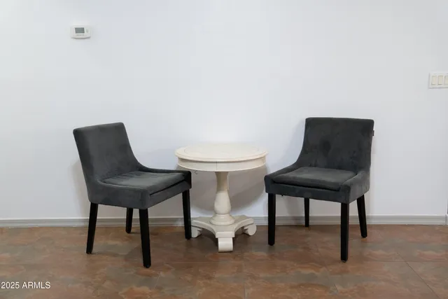 a view of a workspace and a couch in a room