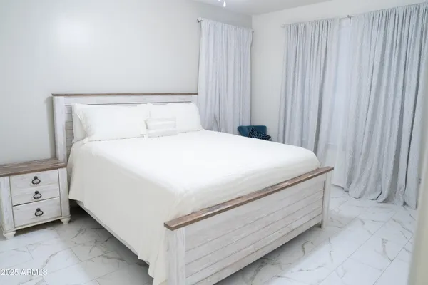 a close up of a bed in a room