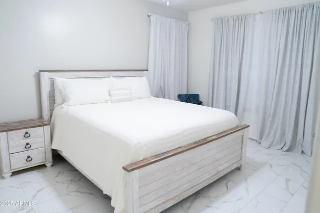 a close up of a bed in a room