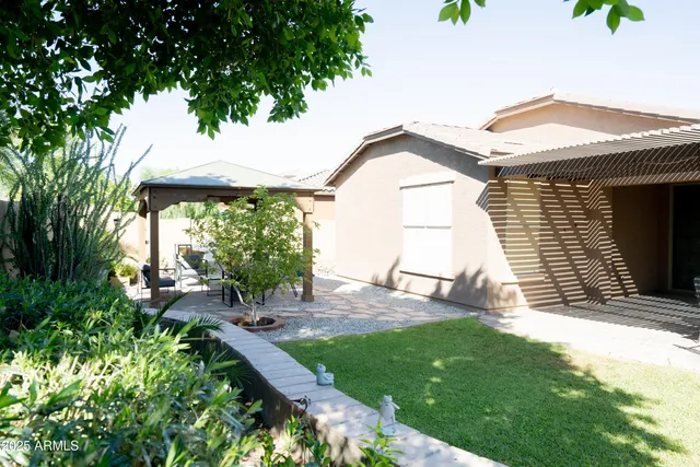 a view of a backyard with a garden and plants