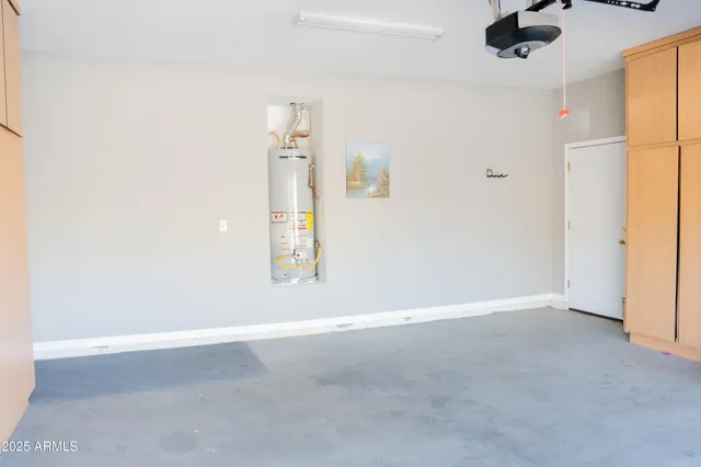 an empty room with a empty space and a ceiling fan