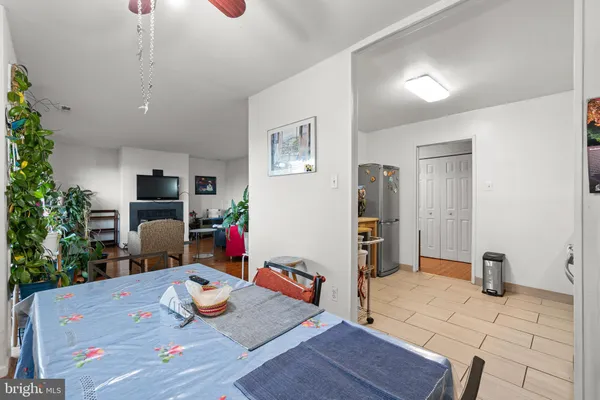 a living room with furniture and flowers