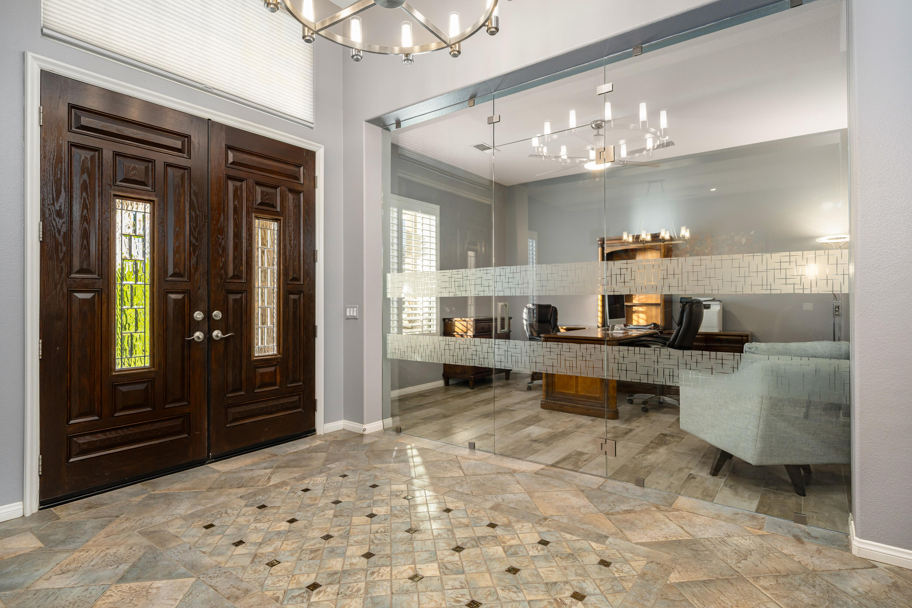 49474 Jordan Street Indio, CA 92201 - Photo 11 of 51 a living room with kitchen island granite countertop furniture and a chandelier