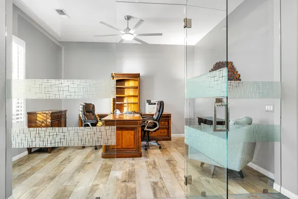 a living room with kitchen island granite countertop furniture and a chandelier