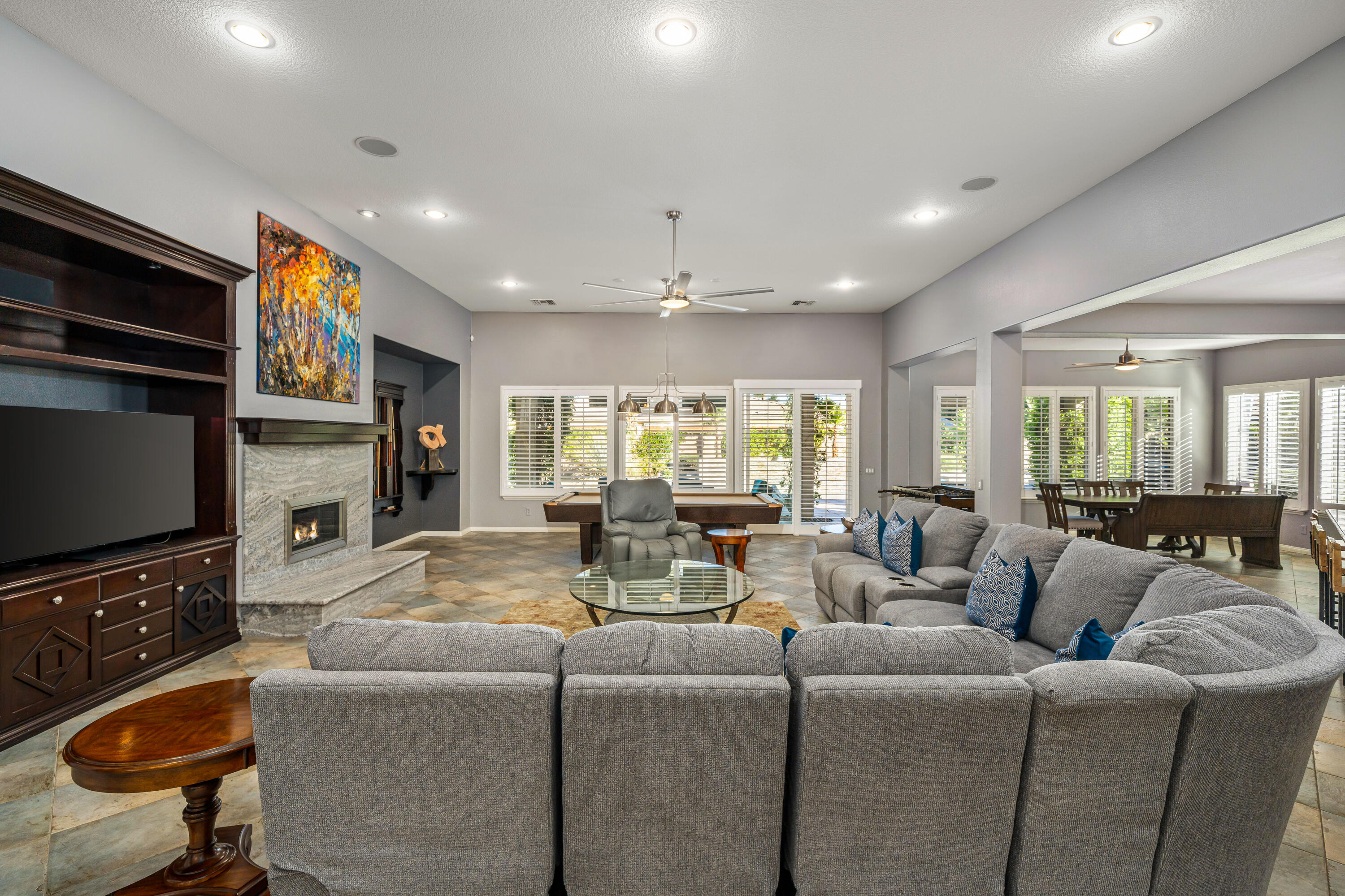 49474 Jordan Street Indio, CA 92201 - Photo 13 of 51 a living room with fireplace furniture and a flat screen tv