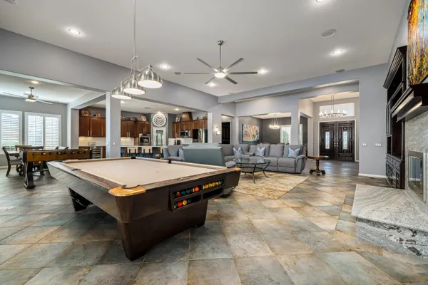 a living room with fireplace furniture and a flat screen tv