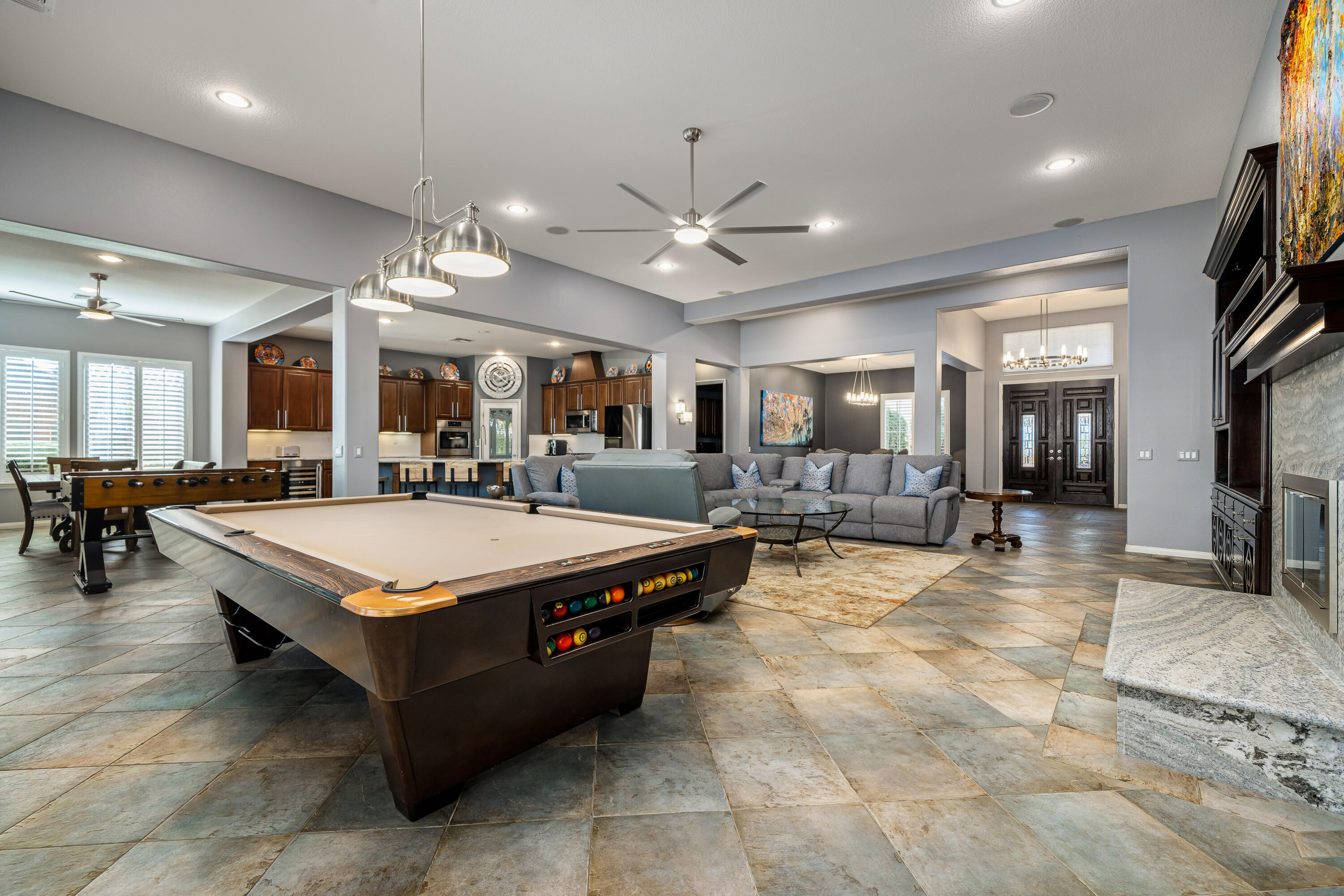 49474 Jordan Street Indio, CA 92201 - Photo 14 of 51 a large hall with stainless steel appliances lots of counter furniture and a view of living room