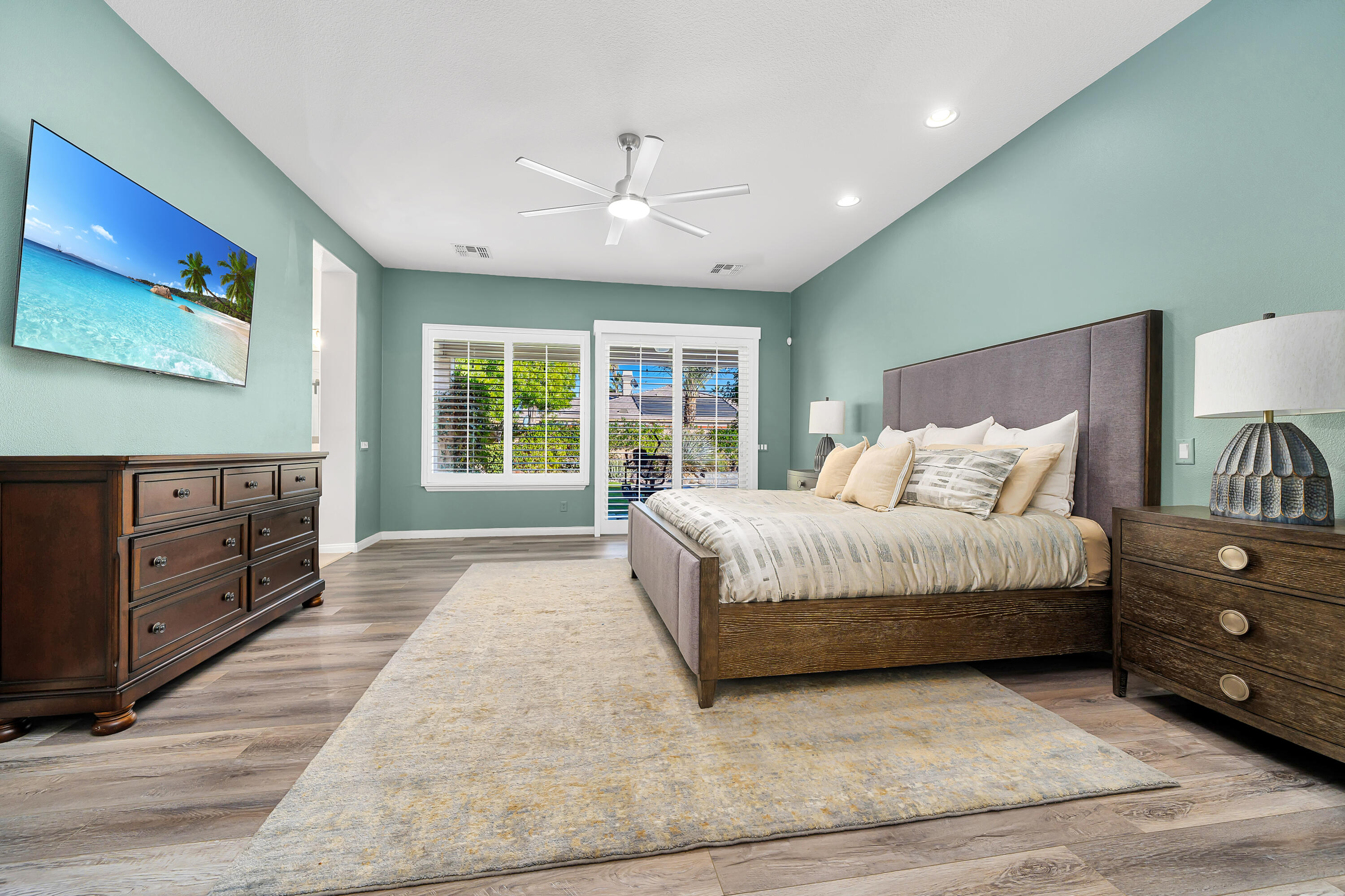 49474 Jordan Street Indio, CA 92201 - Photo 19 of 51 a spacious bedroom with a large bed and a dresser