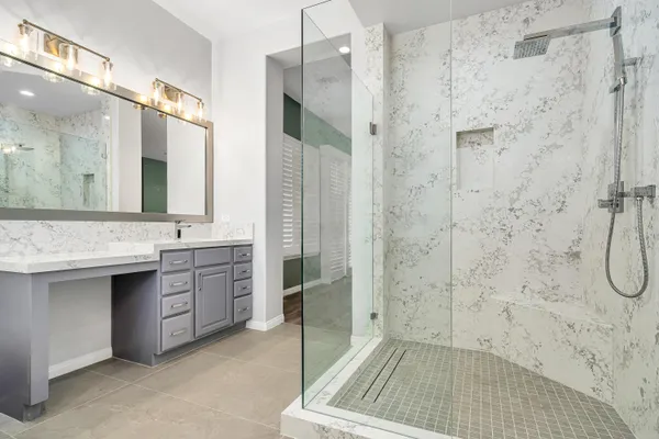 a spacious bathroom with a double vanity sink tub and mirror