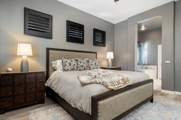 a bedroom with a bed and lamp