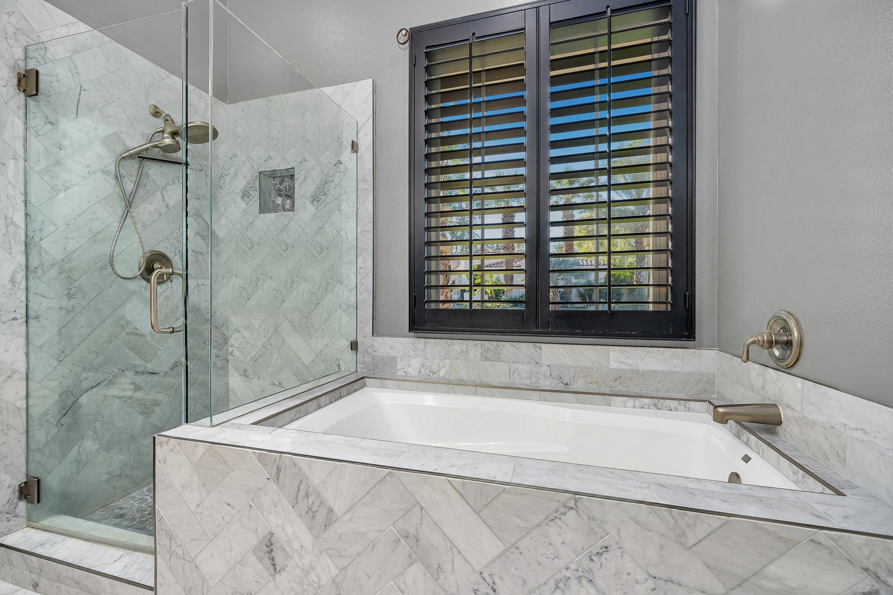 49474 Jordan Street Indio, CA 92201 - Photo 32 of 51 a bathroom with a tub and a shower