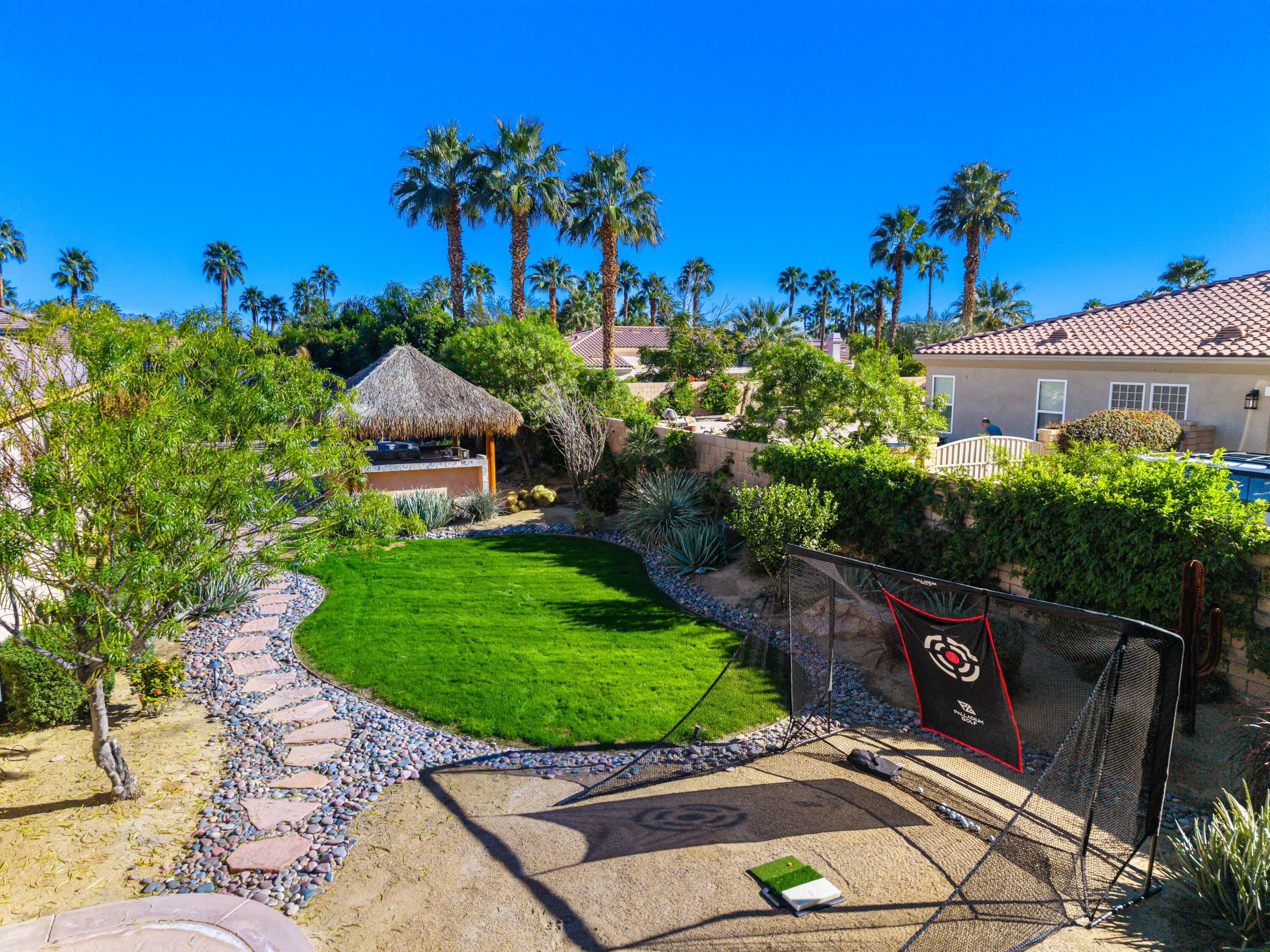 49474 Jordan Street Indio, CA 92201 - Photo 34 of 51 a view of a street with a flower garden