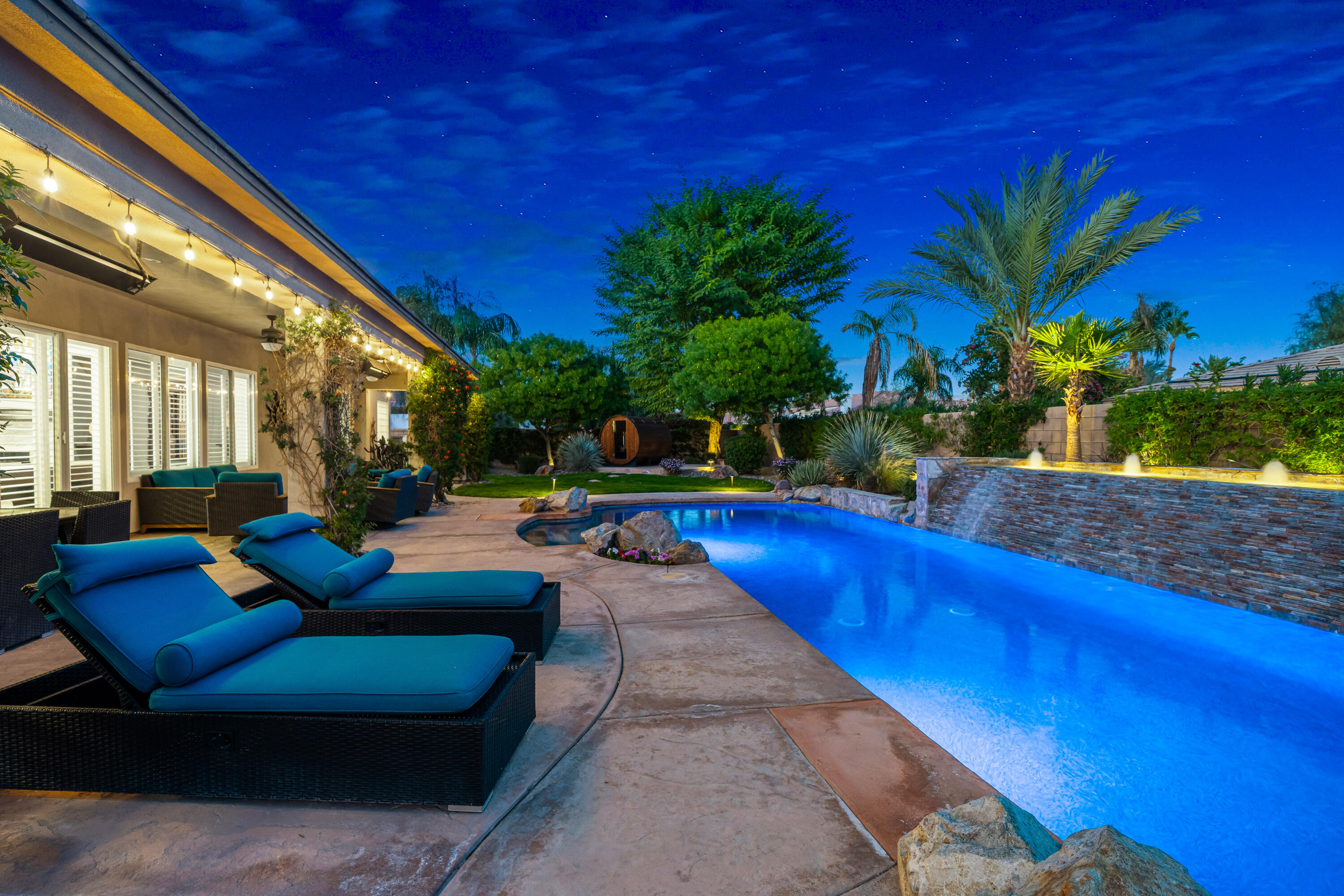 49474 Jordan Street Indio, CA 92201 - Photo 39 of 51 a view of a patio with couches and a fire pit