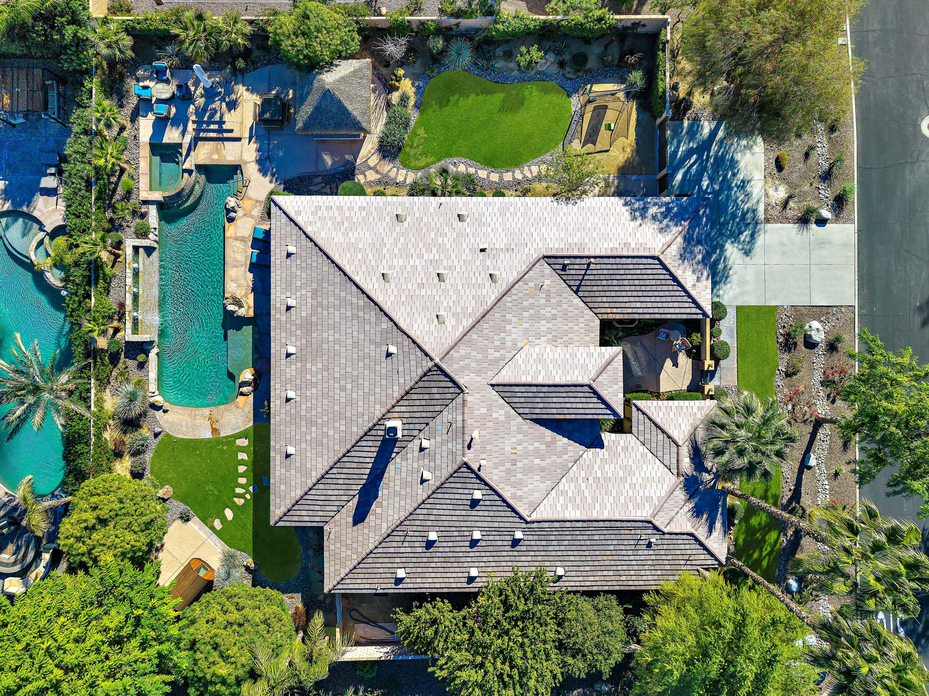 49474 Jordan Street Indio, CA 92201 - Photo 4 of 51 an aerial view of a house with a yard and large trees