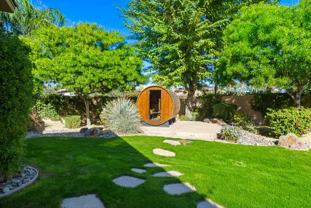 a view of a patio with couches and a fire pit