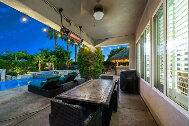 a view of a swimming pool with a patio